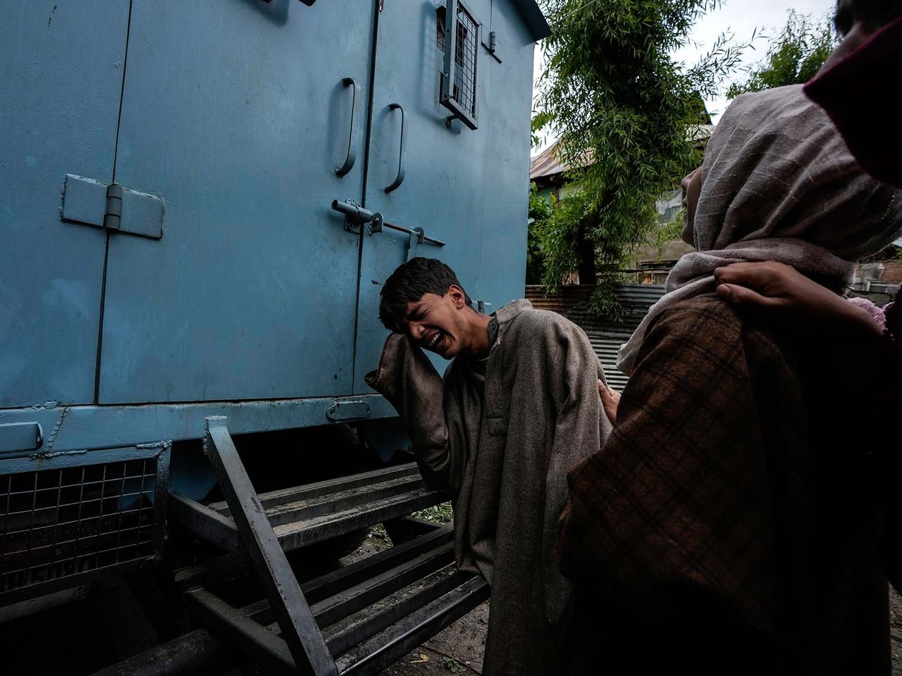 A Kashmiri boy cry as their house damaged during a gun-battle in Malwah village, north of Srinagar, Indian controlled Kashmir, Thursday, April. 21, 2022. Two suspected rebels were killed and four soldiers and a policeman were injured during ongoing gun-battle in north Kashmir on Thursday police said. This project documents ongoing unrest in the long-disputed region of Kashmir, dating back to 1947, when India and Pakistan gained independence  from Britain. Both nations claim Kashmir in its entirety, and each administers a portion of the region. In Indian- administered Kashmir, rebels have been fighting Indian rule for decades, seeking to unite the territory, either  under Pakistani rule or as an independent country. India says that Pakistan supports armed insurgency in Kashmir. Pakistan denies the charge, saying it provides moral and diplomatic support only.
